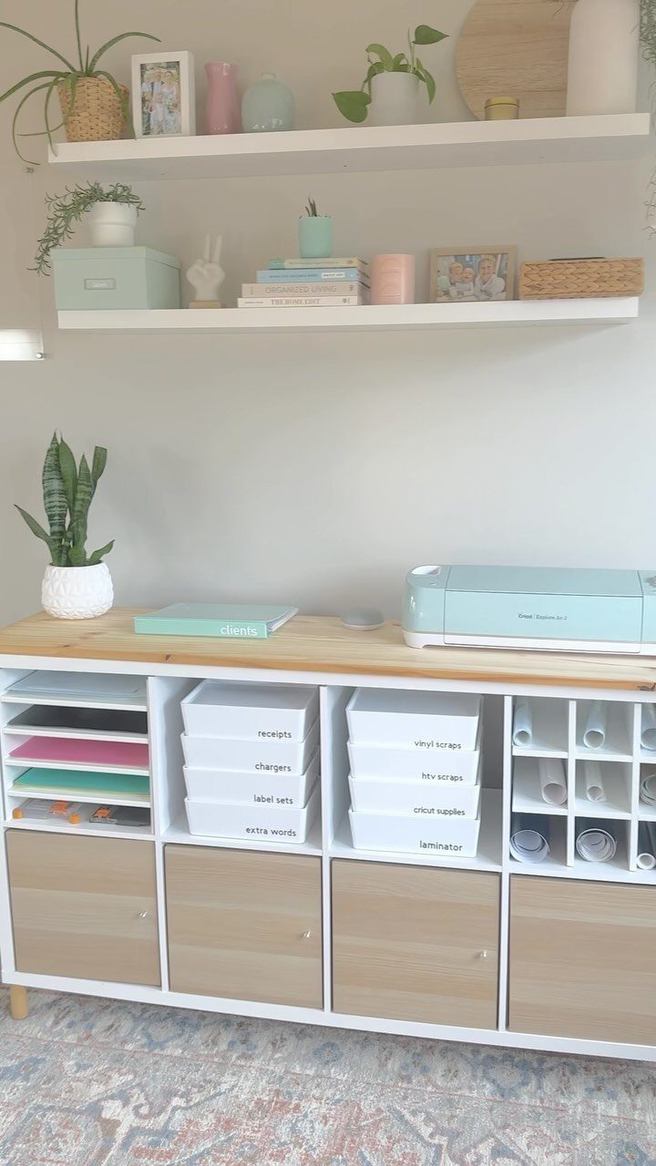 13 Cube Organizer Ideas for Your Living Room Layout 3 White cube storage unit with a light wood plank topper and craft supplies.
